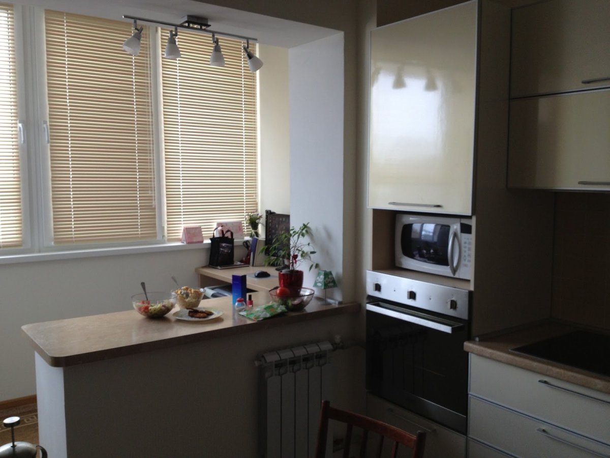 Вынос кухни на балкон