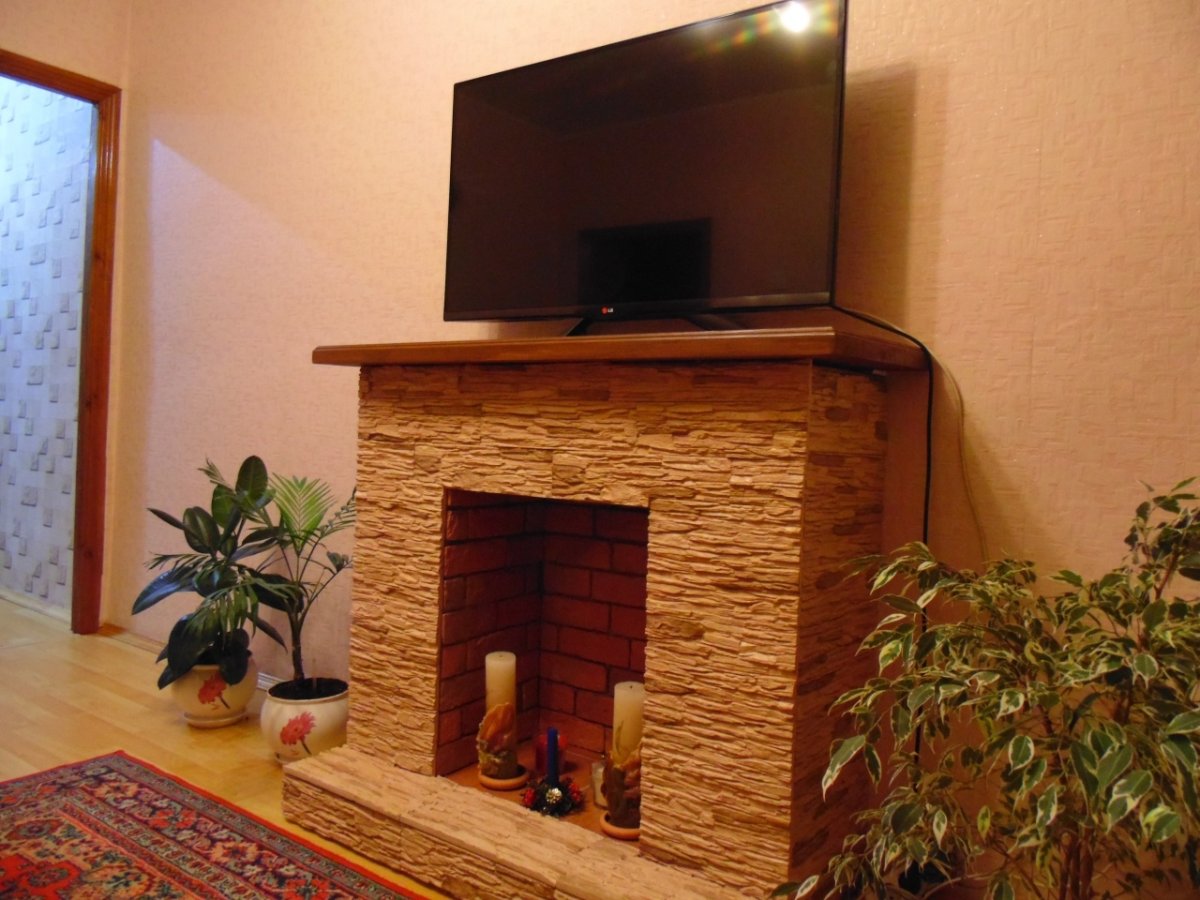 Камин из гипсокартона облицованная камнем