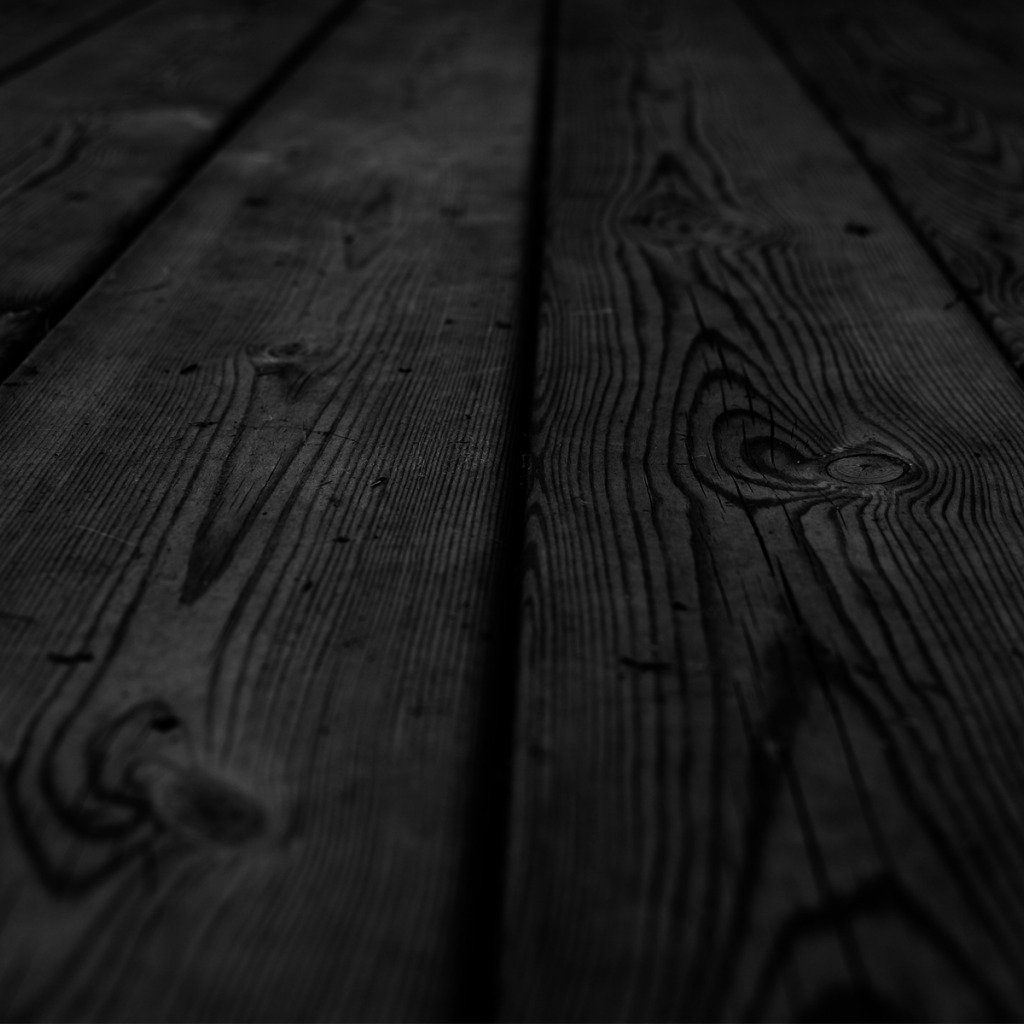Фон черных досок. Темное дерево. Черная деревянная доска. Поверхность стола. Деревянная столешница текстура.