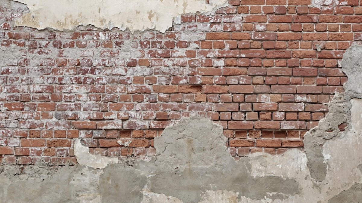 Кирпичная стена со штукатуркой