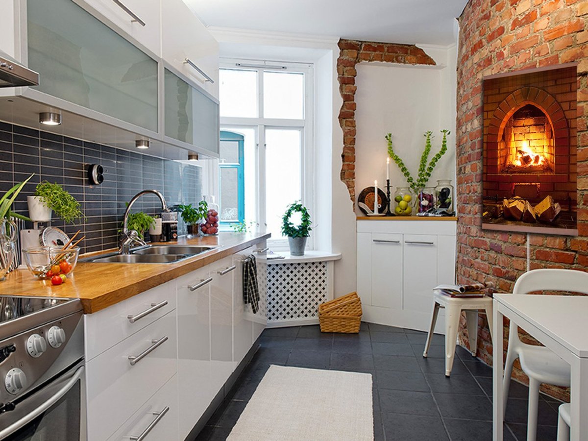 Кухня с белой кирпичной стеной в квартире