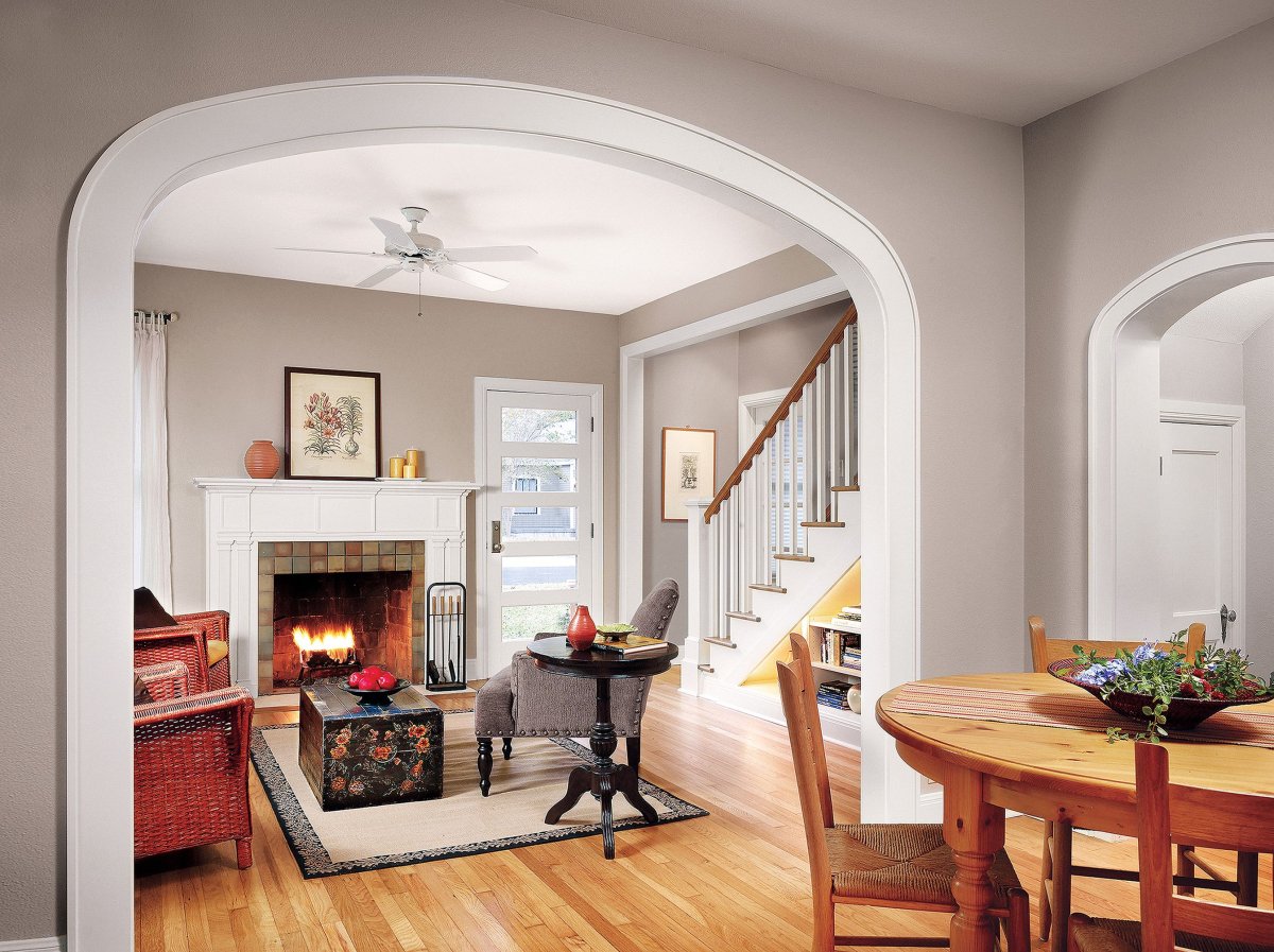 Камины в интерьере гостиной фото в углубление арки