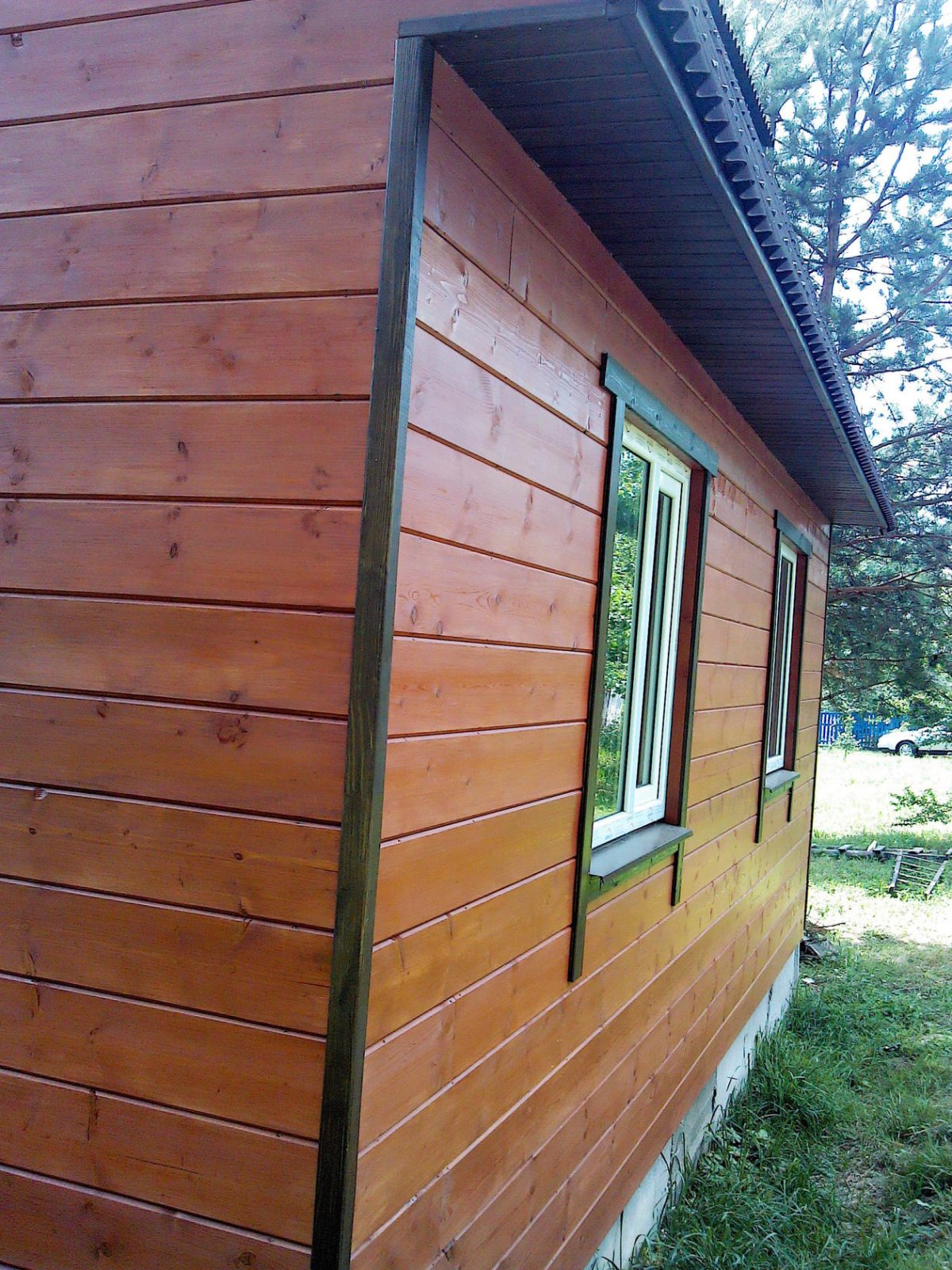 Отделка фасада доской в нахлест