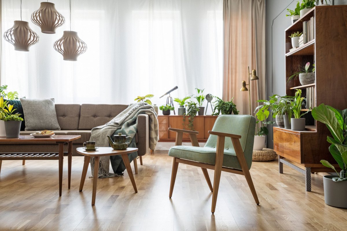 Stock-photo-real-photo-of-a-Green-Armchair-standing-in-a-Bright-natural-Living-Room-Interior-with-Macrame-1118031719